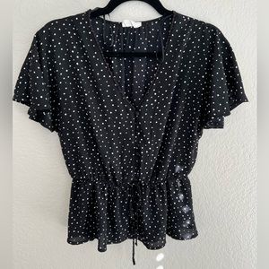 Black short sleeved peplum style shirt